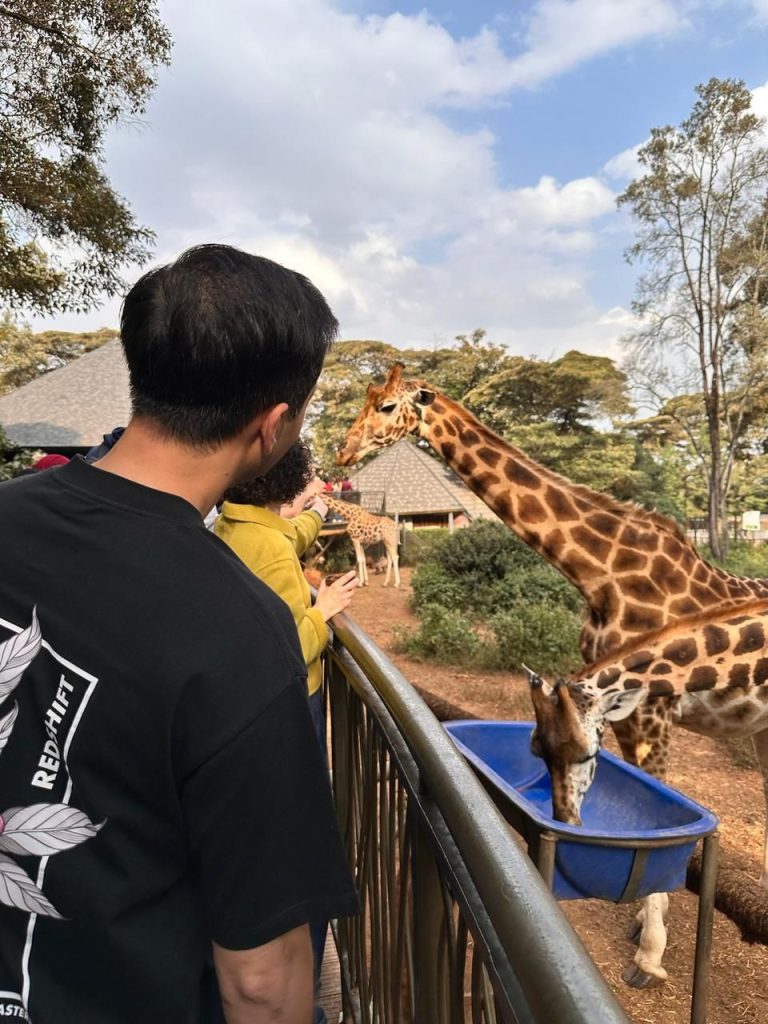 Cotis Safaris' Guests Feeding a Giraffe at Giraffe Centre Nairobi